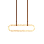 Clérachic Vista isolated on white and lit, showing the ring's honey veining and its slim metal strap fittings.