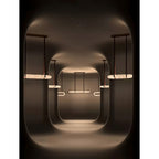 Clérachic Vista repeated through a darkened room, each lit ring throwing a soft oval of light onto the walls.