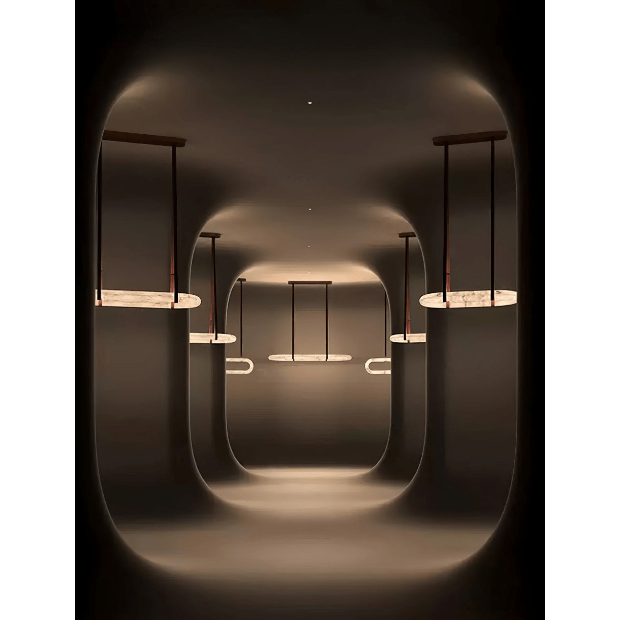 Clérachic Vista repeated through a darkened room, each lit ring throwing a soft oval of light onto the walls.