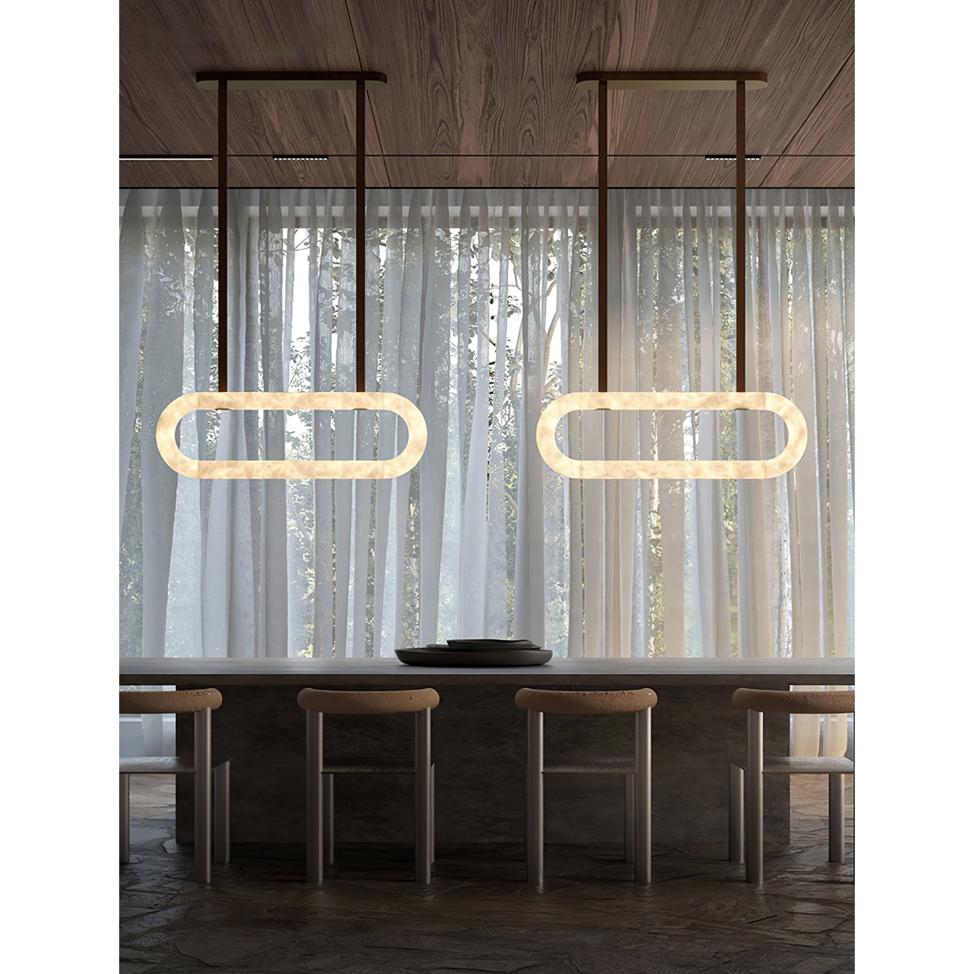 Two Clérachic Vista rings lit over a bar counter and stools, glowing against floor-length sheer curtains.