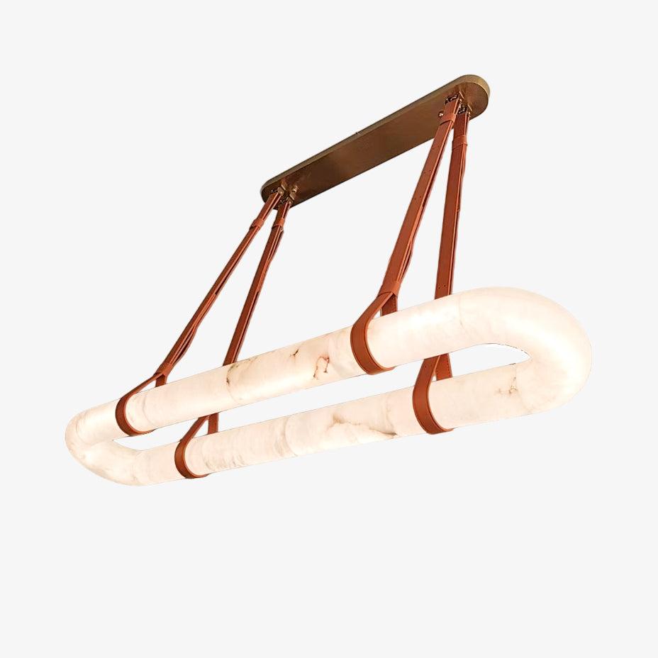 Clérachic Vista tilted for a three-quarter view, the tan straps stitched and riveted onto a solid bronze mount.