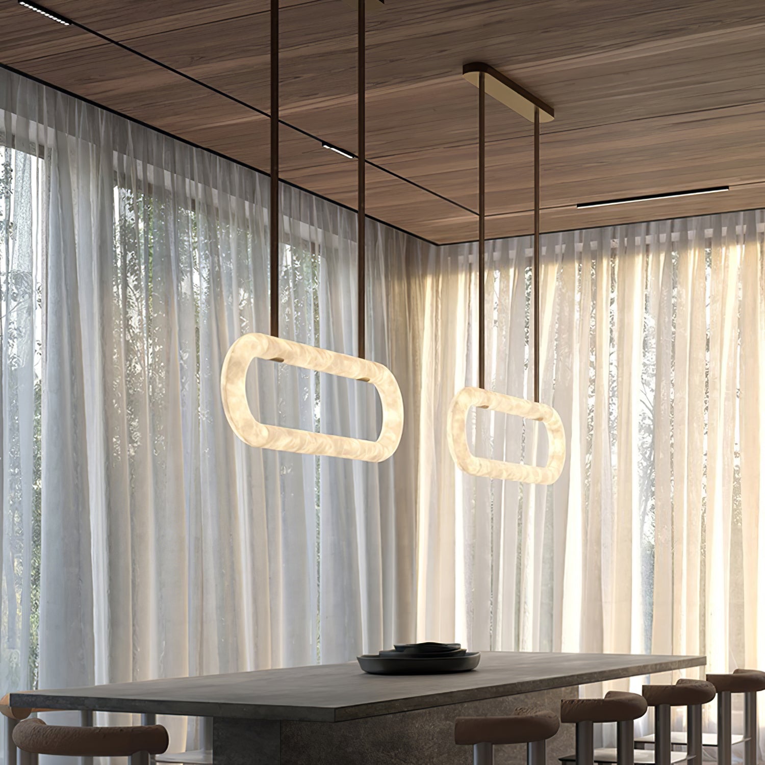 The Clérachic Vista in pairs beneath a timber ceiling, lit rings hovering over a dark dining table.