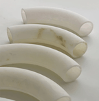 The Clérachic Vista's curved alabaster sections laid side by side, showing the cut ends and pale natural veining.