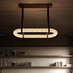 The Clérachic Vista lit on a dark timber ceiling, its glow spilling down over the shelving below.