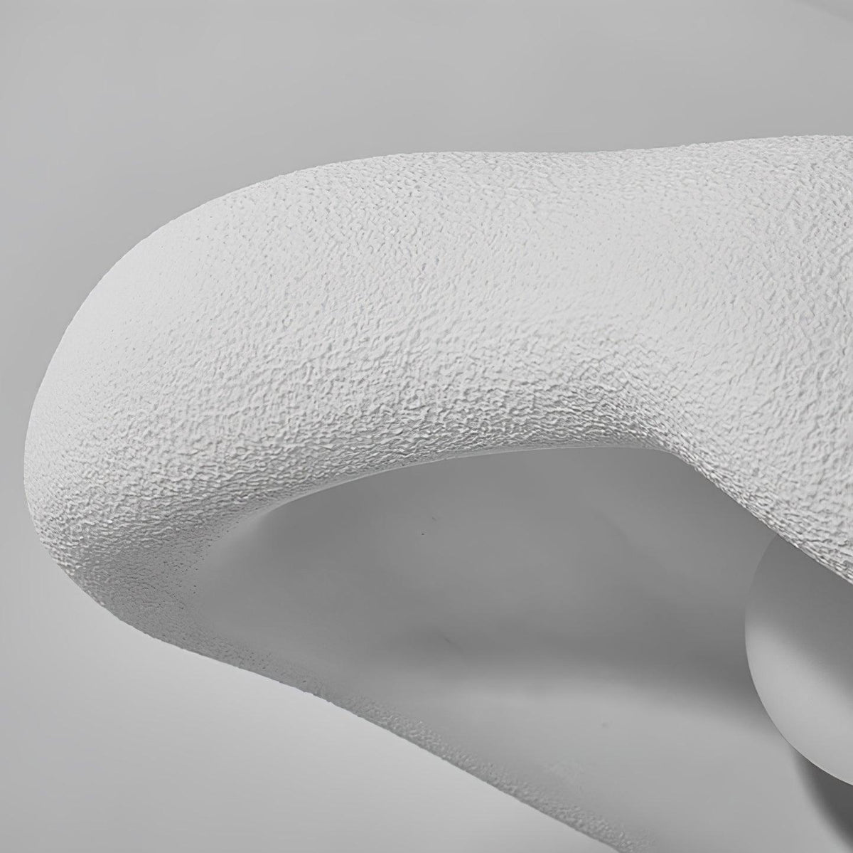 Close view of the rough, pitted surface on the rolled edge of this Clérachic white pendant shade.