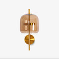 Gold & Coffee version of this Clérachic wall light: a coffee-tinted glass shade on a slim gold stem with a round gold backplate, on white.