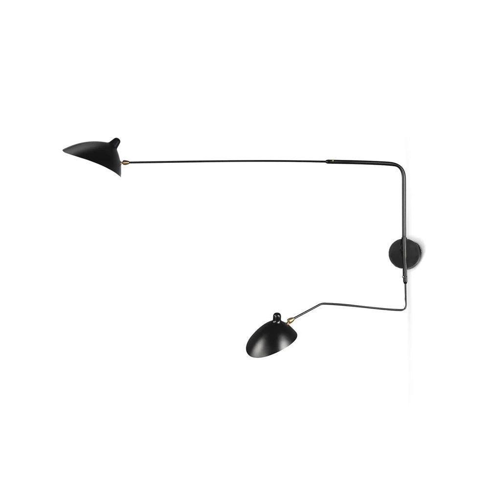 Clérachic two-head wall light on a plain white backdrop, its long black arms ending in cone shades with brass joints.
