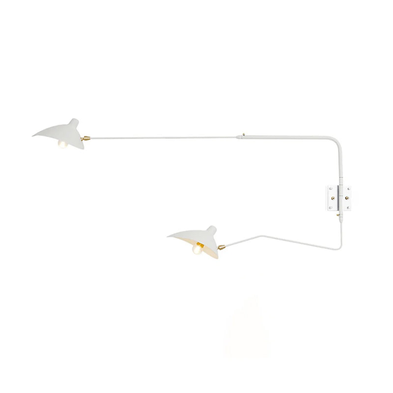 White Clérachic two-head wall light on a plain white backdrop, with long curved arms and brass-coloured joints.