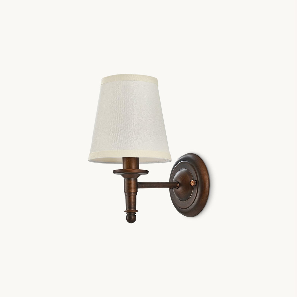 Antique brown Clérachic wall light with a white tapered fabric shade, a short straight arm and a round backplate, on a plain white backdrop.