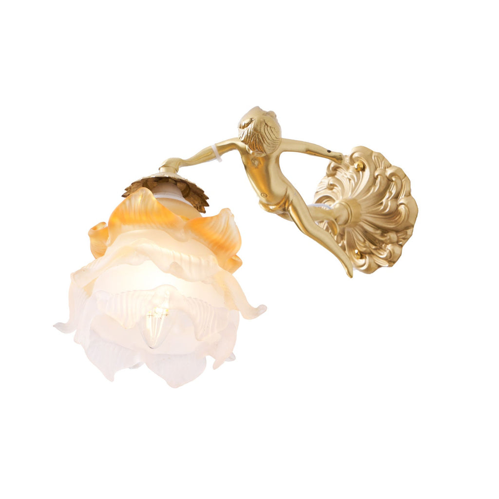 A Clérachic cherub wall light with a lit rose shade and round scrolled back plate, cut out on a plain white background.