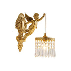 A left-facing Clérachic cherub wall light with a crystal-fringed shade, shown on a plain white backdrop.
