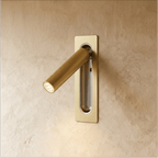 Clérachic slim wall-mounted reading light in brushed brass, its spotlight arm swung out from the plate.