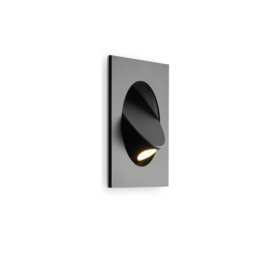 Side view of this black Clérachic recessed wall light on a plain white backdrop, with its hood swung out and the LED lit.