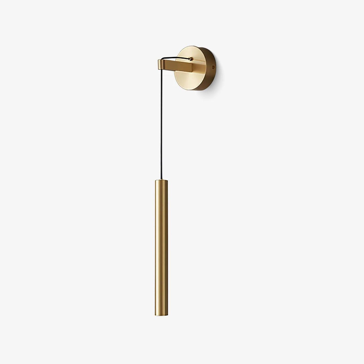 Brass wall light with a round backplate and a slim brass tube hanging on a black cord, on a plain white backdrop, from Clérachic.