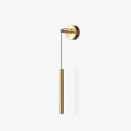 Brass wall light with a slim tube on a white background, with a faint shadow beside it, from Clérachic.