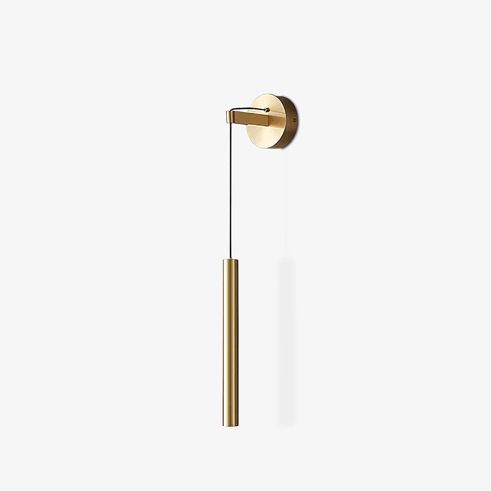 Brass wall light with a slim tube on a white background, with a faint shadow beside it, from Clérachic.