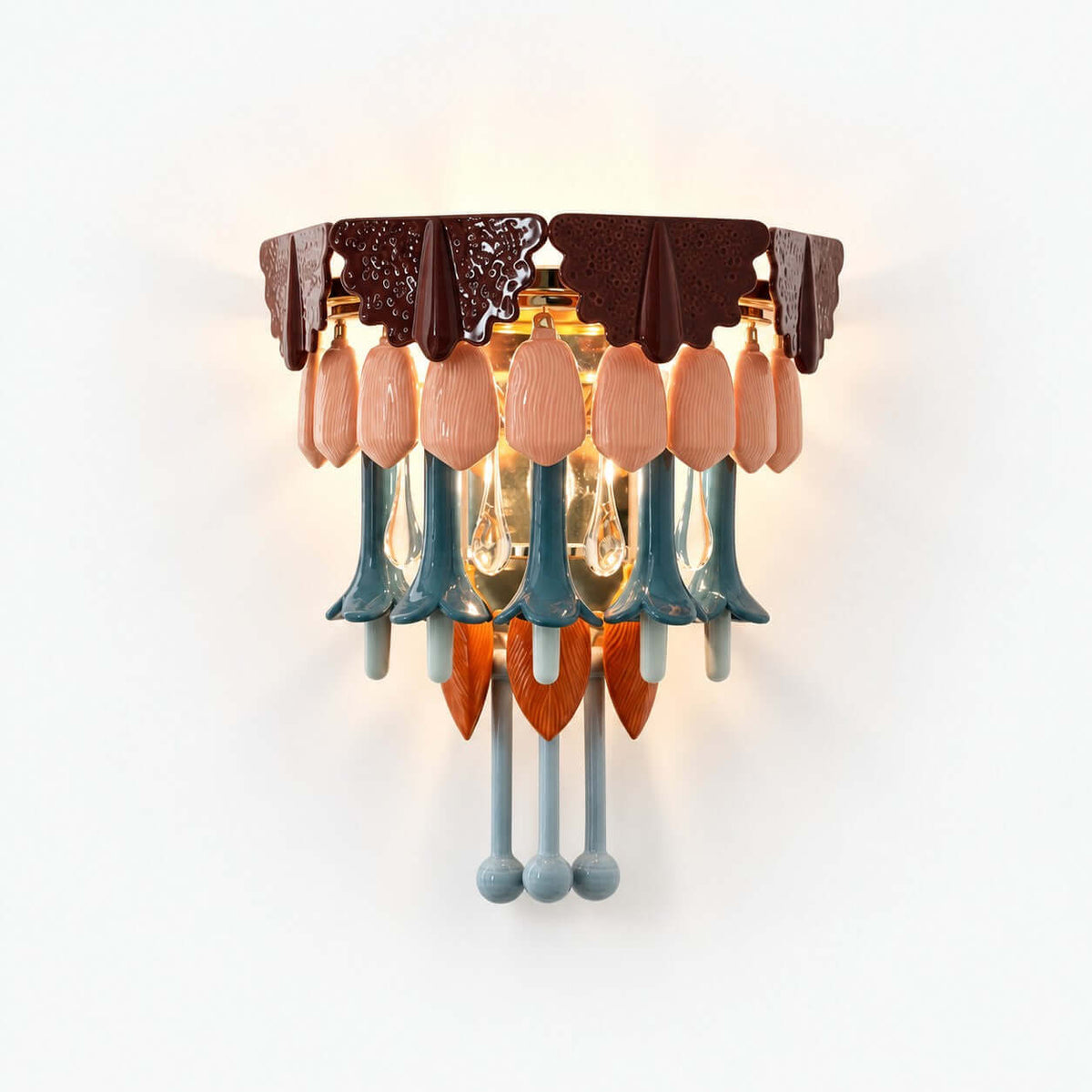 This Clérachic wall sconce on a white background, with a burgundy scalloped top, pink ceramic petals, teal drops and clear glass teardrops.