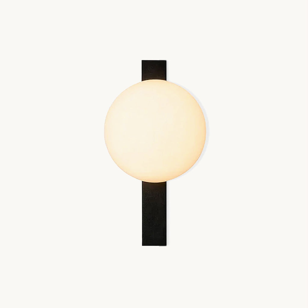 Cream globe shade beside a flat black metal bar, on this Clérachic wall light, shown on a plain white backdrop.