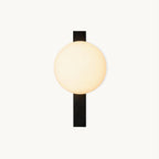 Cream globe shade beside a flat black metal bar, on this Clérachic wall light, shown on a plain white backdrop.