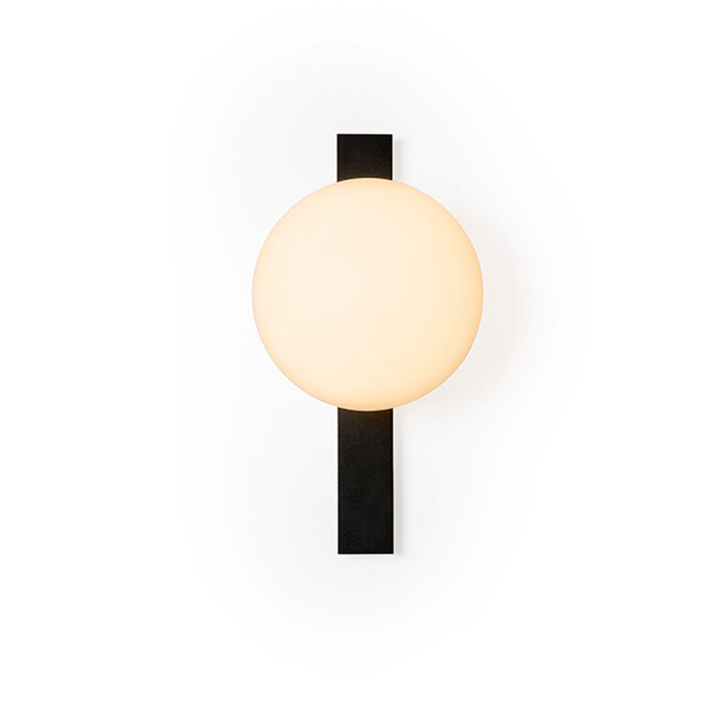 Cream globe glowing softly beside a black bar on this Clérachic wall light, shown on a plain white backdrop.