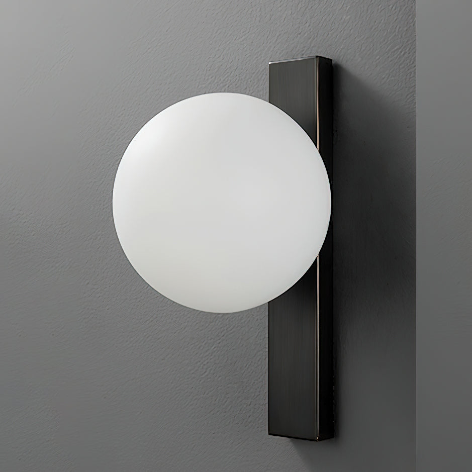 An unlit white globe sits against a dark metal bar on a charcoal wall, a side-on view of this Clérachic wall light.