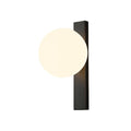 Cut-out of this Clérachic wall light on white, its warm lit globe overlapping the top of a tall black metal bar.