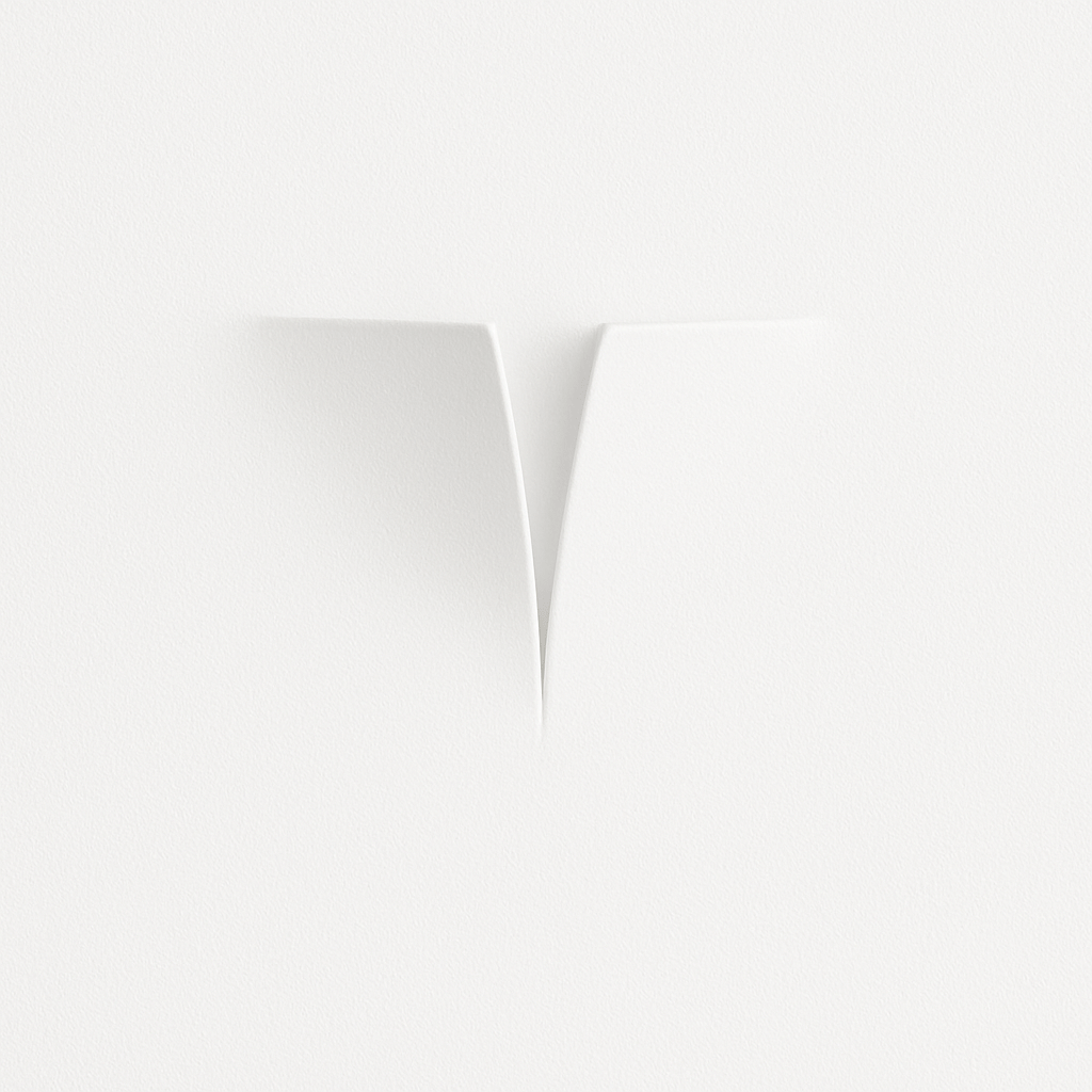 Clérachic white plaster-style wall light unlit, two curved faces meeting at a narrow V-shaped opening on a white wall.