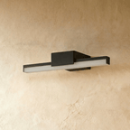 Clérachic short black linear bar wall light with a frosted diffuser, shown unlit on a warm plaster-effect wall.
