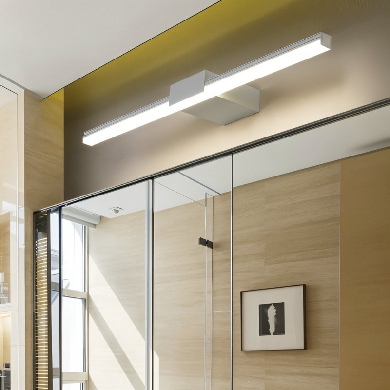 Clérachic white linear wall light with a frosted diffuser above a glass-fronted cabinet in a light timber-lined room.