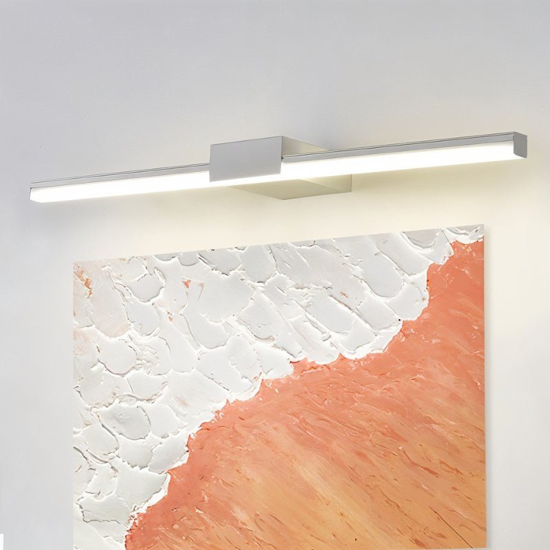 Clérachic white linear wall light above a textured orange and white painting on a pale grey wall.