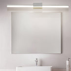 Clérachic long white linear wall light above a frameless rectangular mirror and white basin in a bathroom.