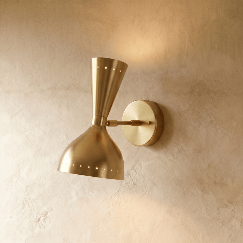 Clérachic wall lamp in brushed brass, an hourglass shade with perforated rims on a round wall plate.