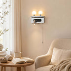 This Clérachic wall light in chrome lights a reading corner with a boucle armchair, a round table and an open book.