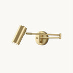 This Clérachic wall light on a plain white backdrop, in gold, with a round backplate, a folding arm and a small cylinder head.