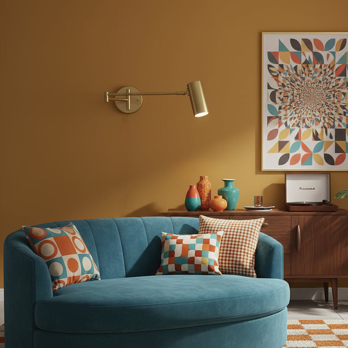 This Clérachic gold wall light on an ochre wall, above a teal sofa and a walnut sideboard, with a geometric print beside it.