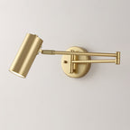 A Clérachic gold wall light with a long folding arm, with the cylinder head aimed down at the left.