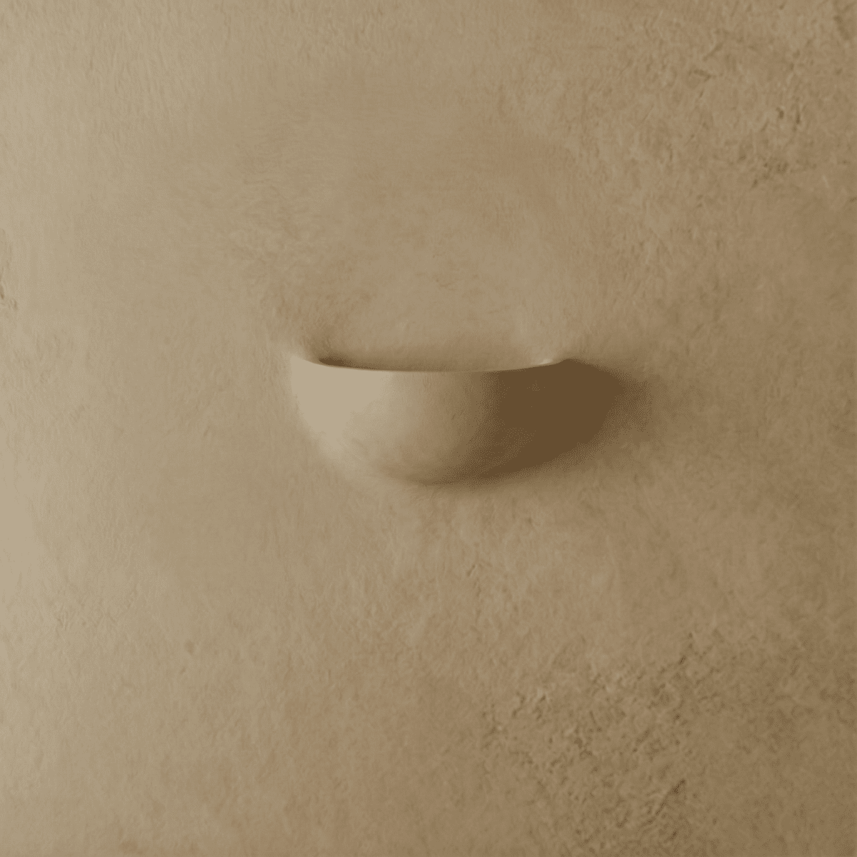 Clérachic half-moon plaster wall light switched off, a smooth matte shell mounted flat on a warm beige limewash wall.