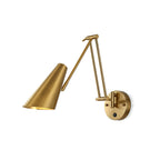 Clérachic gold swing-arm wall light with a wide conical shade and a round backplate, on a white background.