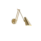 Small Clérachic gold swing-arm wall light with a conical shade angled to the right of its backplate, on a white background.