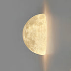 Clérachic half-moon wall light on a grey wall, with a warm glow spilling from the flat edge.