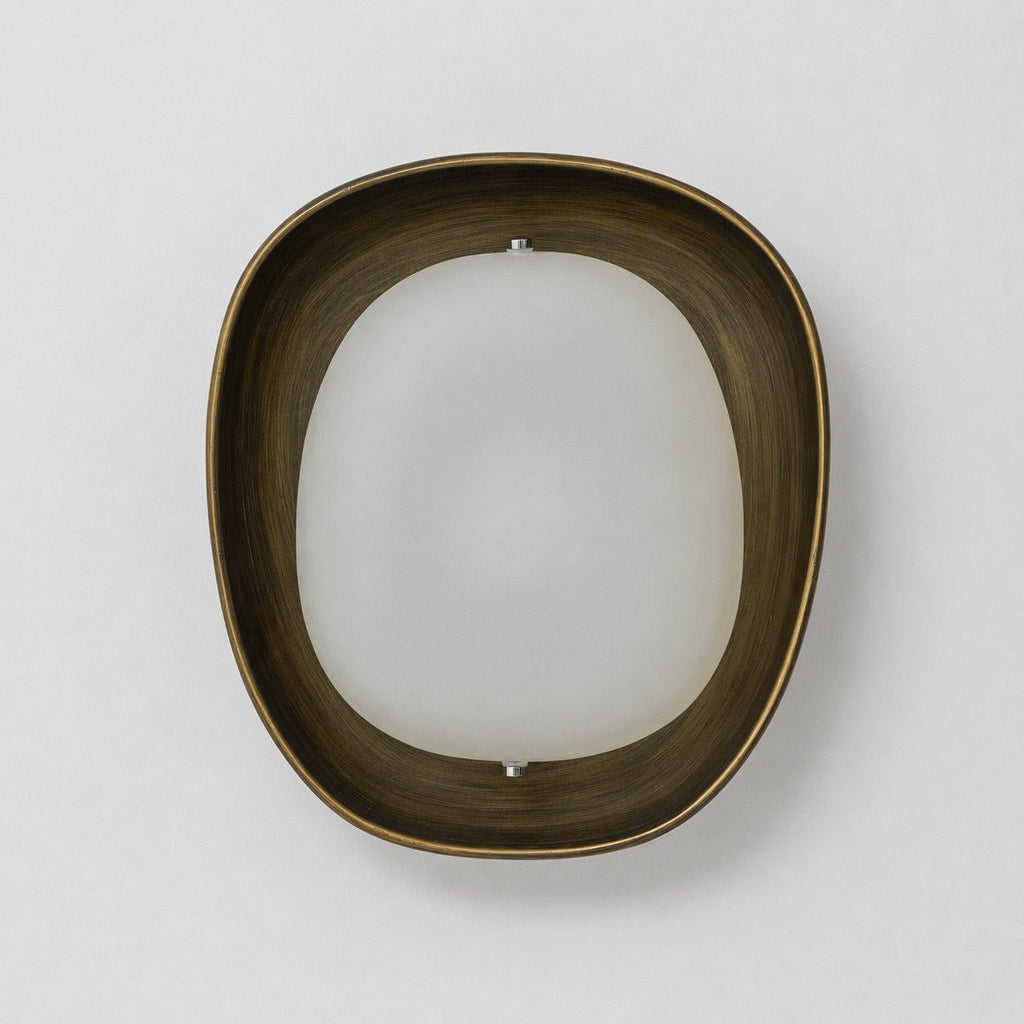 Straight-on view of a Clérachic wall light switched off, with a dark bronze rim around a frosted white oval shade, on a pale wall.