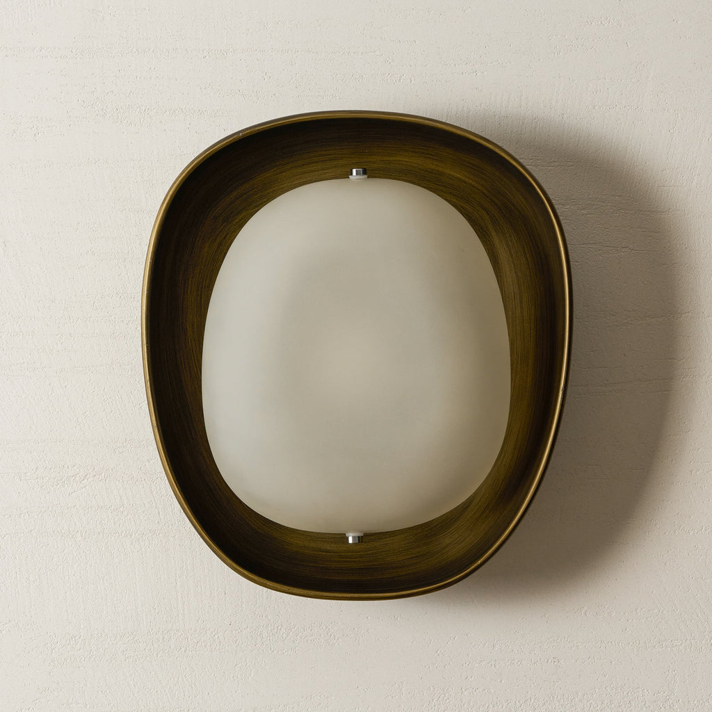 This Clérachic wall light, switched off, shows a cloudy frosted shade in a dark bronze bowl against a cream plaster wall.