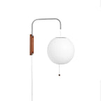 Round white globe on a steel arm, with the walnut bracket and bead pull of this Clérachic wall light, on a plain white backdrop.