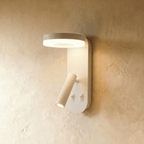 Clérachic white wall reading light with a glowing circular LED ring, an angled tube spotlight and two rocker switches.