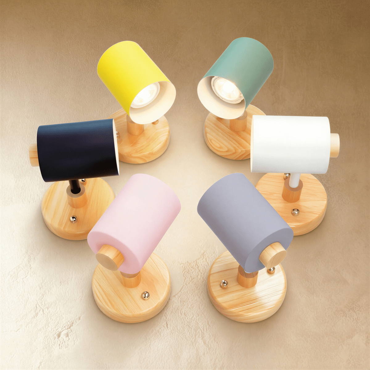 Clérachic wall lamp range in six shade colours on round wooden bases, with GU10 bulbs glowing inside the open shades.