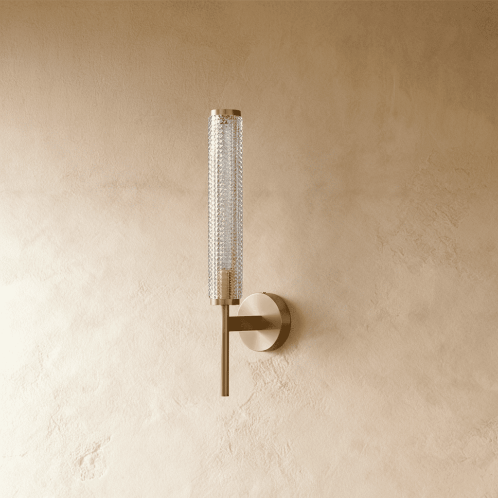 Clérachic unlit brass wall sconce with a fine diamond-textured clear glass cylinder on a slim arm and round backplate.