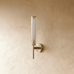 Clérachic unlit brass wall sconce with a fine diamond-textured clear glass cylinder on a slim arm and round backplate.