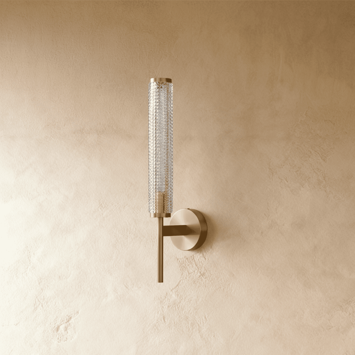 Clérachic unlit brass wall sconce with a fine diamond-textured clear glass cylinder on a slim arm and round backplate.