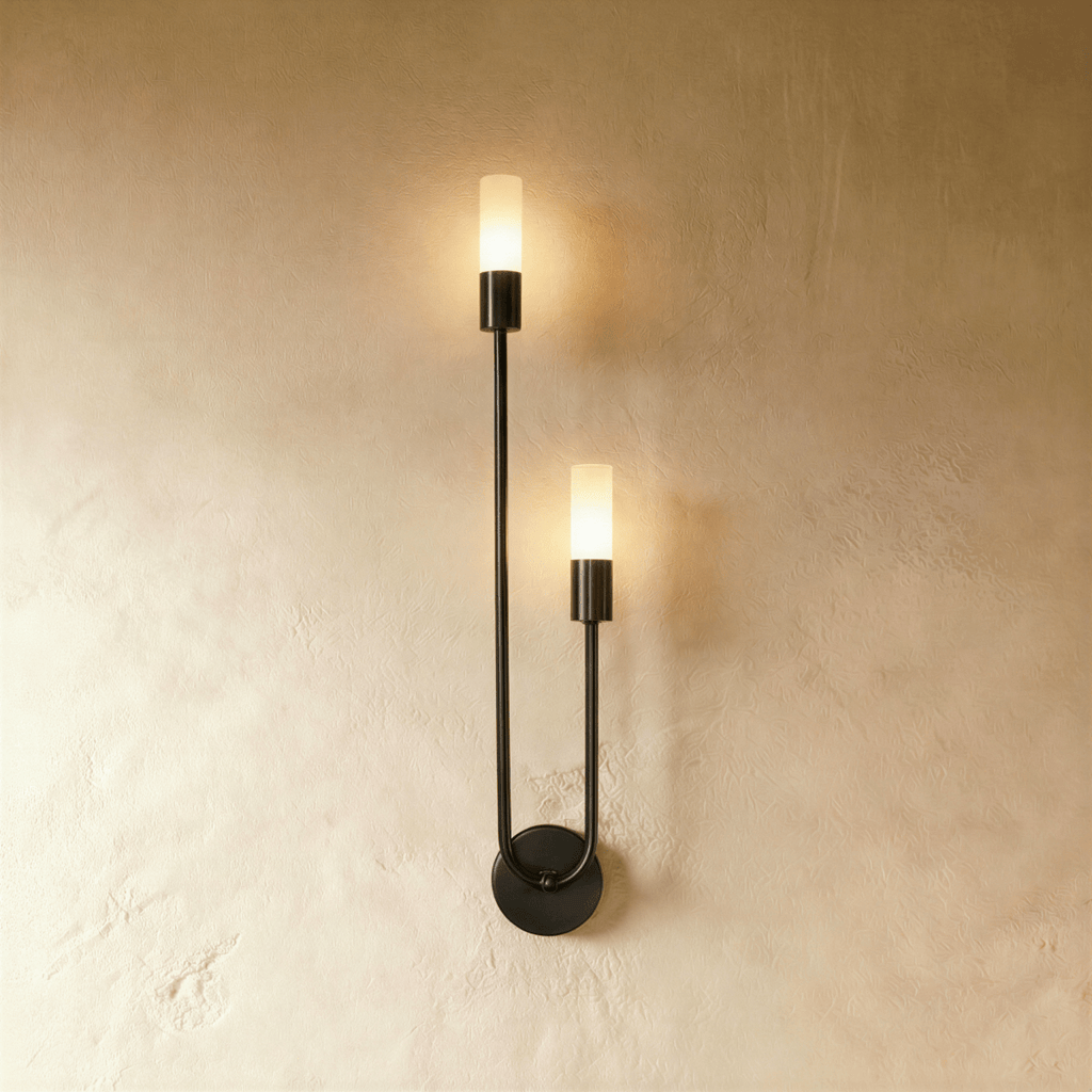 Clérachic black wall light, mirrored version, with two lit frosted cylinder diffusers at different heights on a thin arm.
