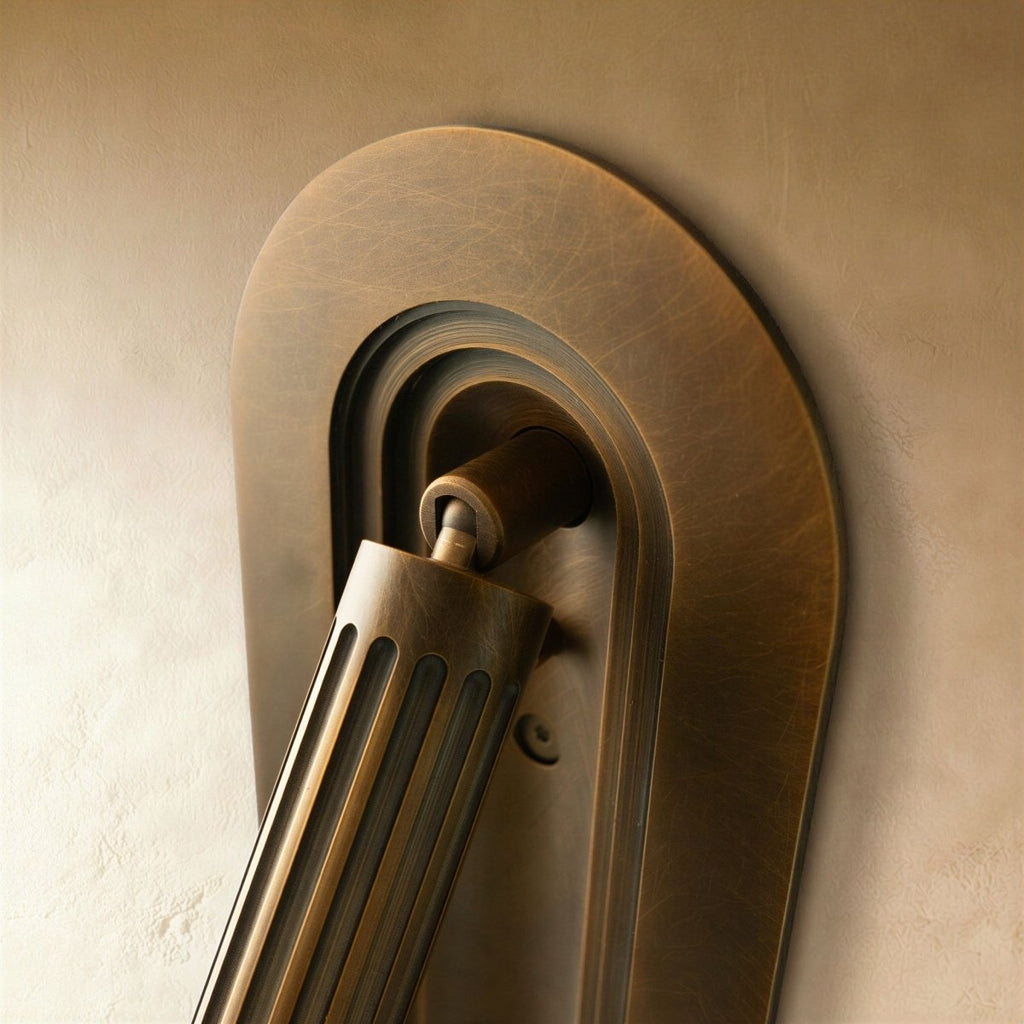 Clérachic embedded wall light detail, stepped oval recess and a fluted brass cylinder on its pivot